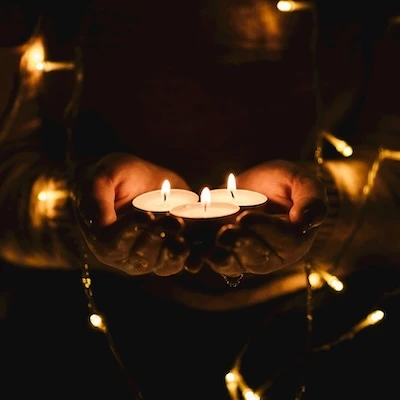 Hands with candles