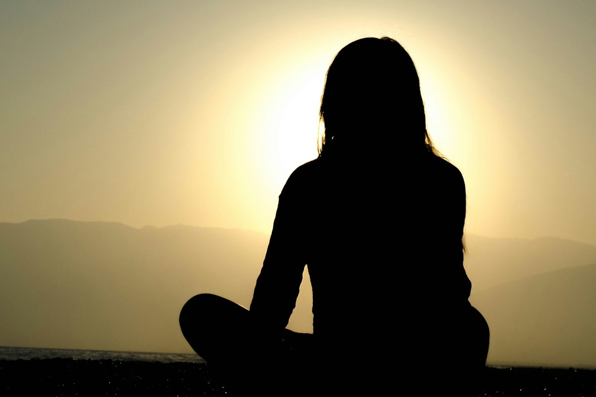 Woman_Meditating_Sun